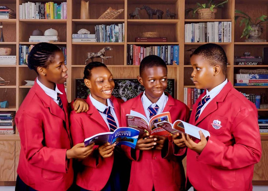 Supreme Reagan Schools pupils reading together in the library